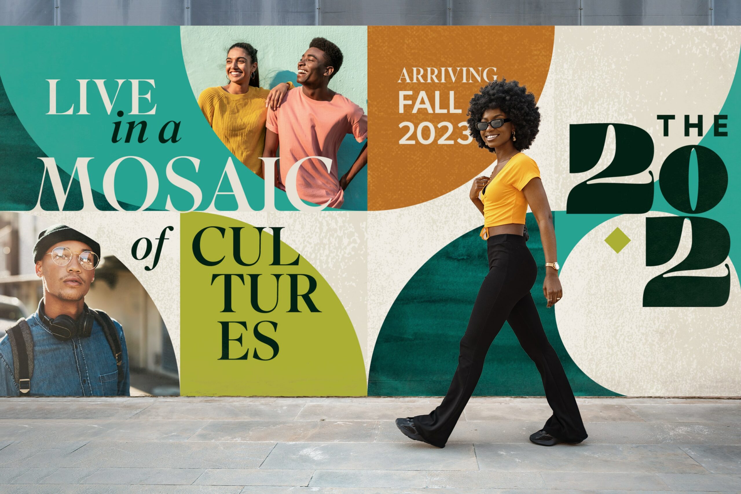 A woman smiling, walking past an exterior banner design highlighting The 202 Apartments in Washington, DC.