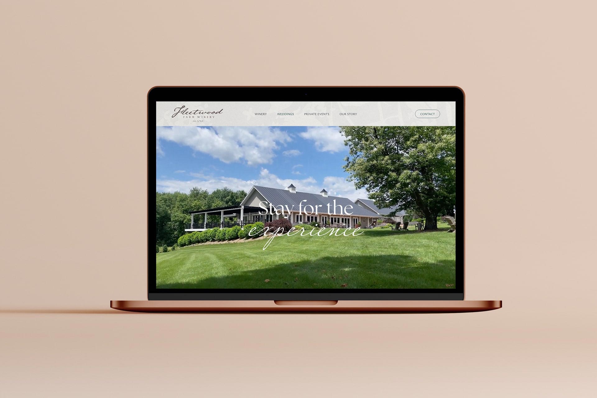 A graphic design featuring a laptop showcasing the winery website design of Fleetwood Farm Winery in Leesburg VA.